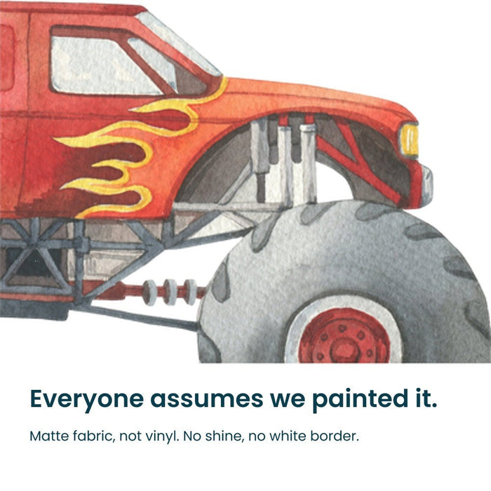 Close-up of a hand-painted red monster truck decal on matte fabric