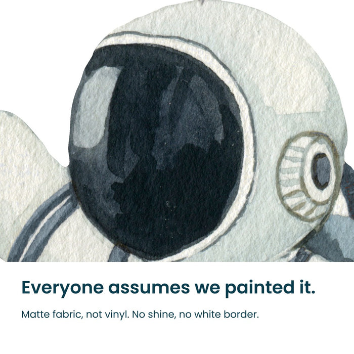 Close-up of the hand-painted planet and rocket decals