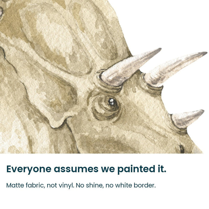 Close-up of the hand-painted watercolour triceratops frill and horns on matte fabric