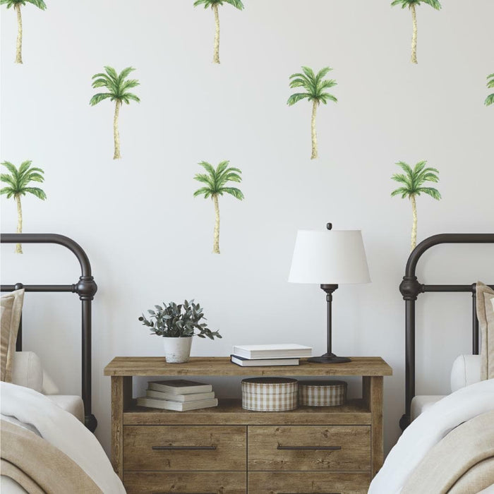 Mini palm tree decals scattered above a timber bedside table