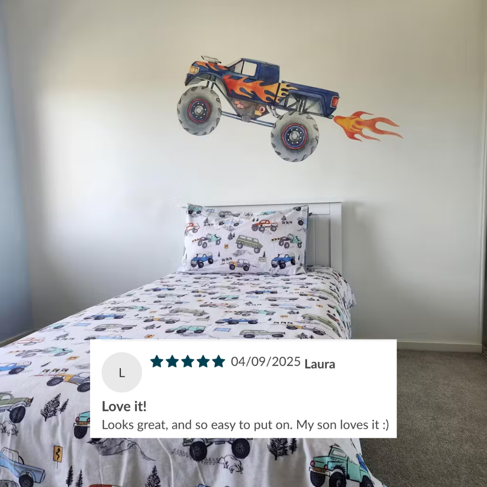 Customer photo of a blue monster truck wall decal in a kids bedroom