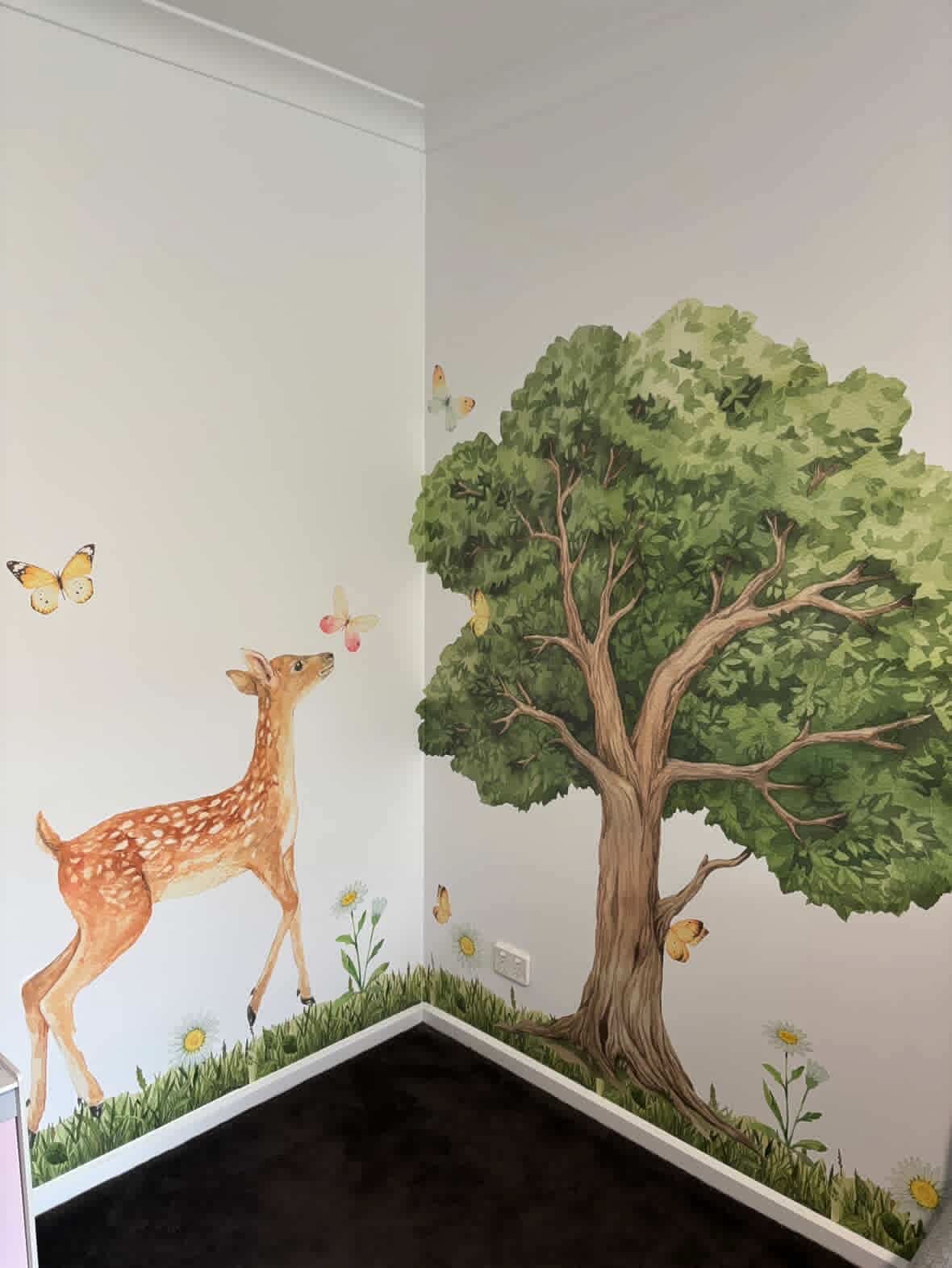 Oak tree wall decal with a deer and butterflies in a room corner