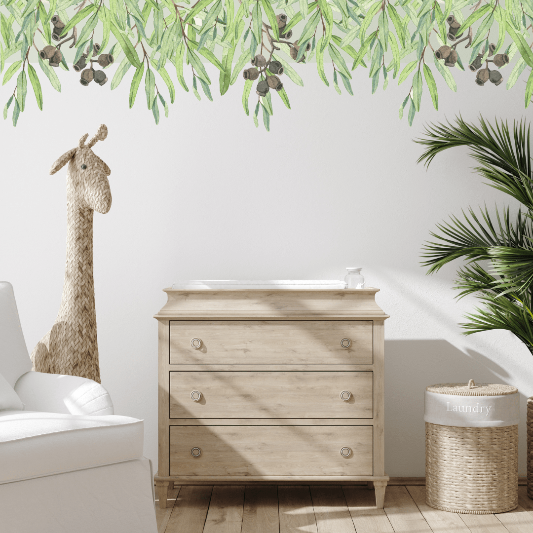 Gumnut leaf wall trim decal along the top of a wall above a timber dresser