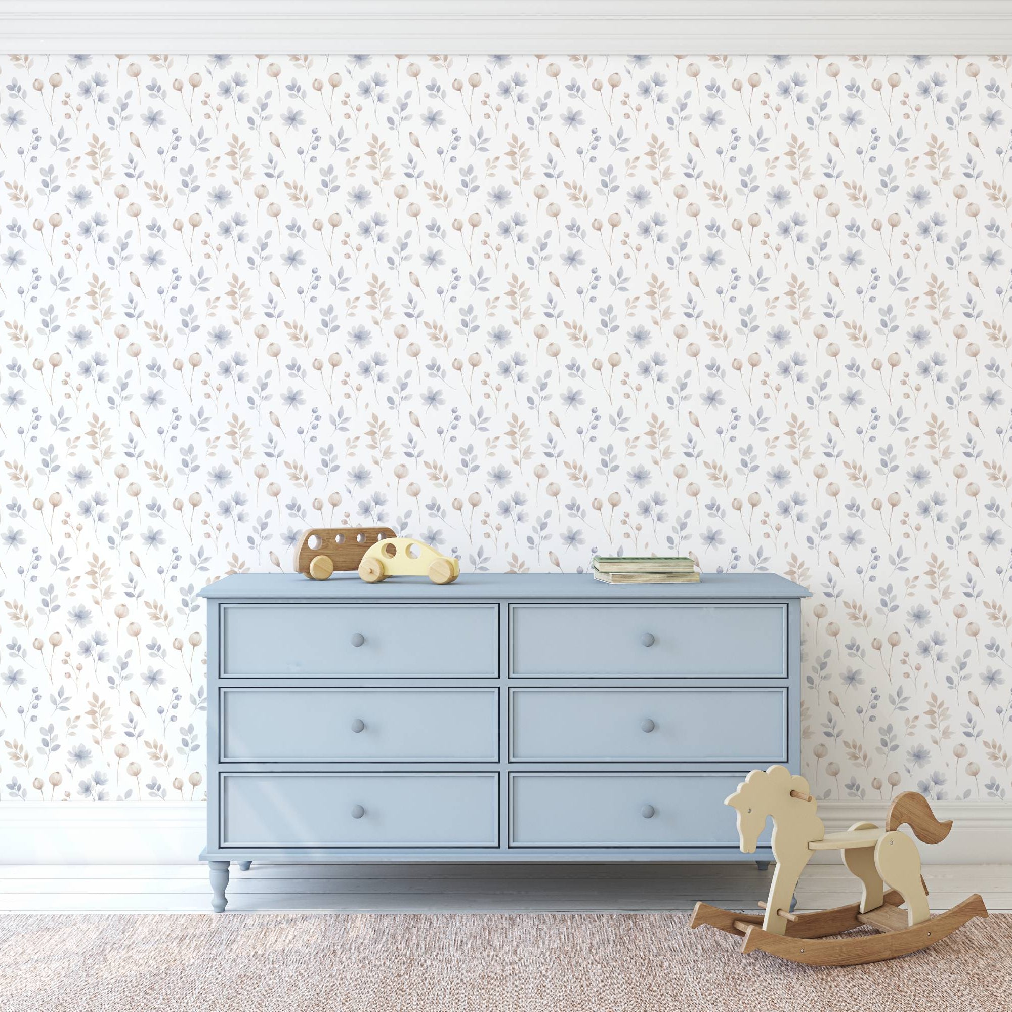 Blue dresser against a floral wallpapered wall with toys on top