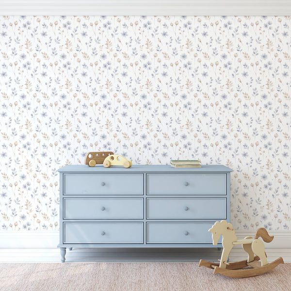 Blue dresser against a floral wallpapered wall with toys on top