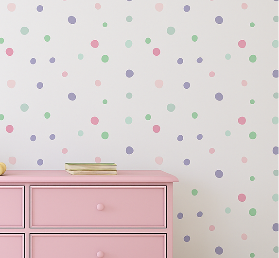 Pink dresser with toys against a polka dot wall