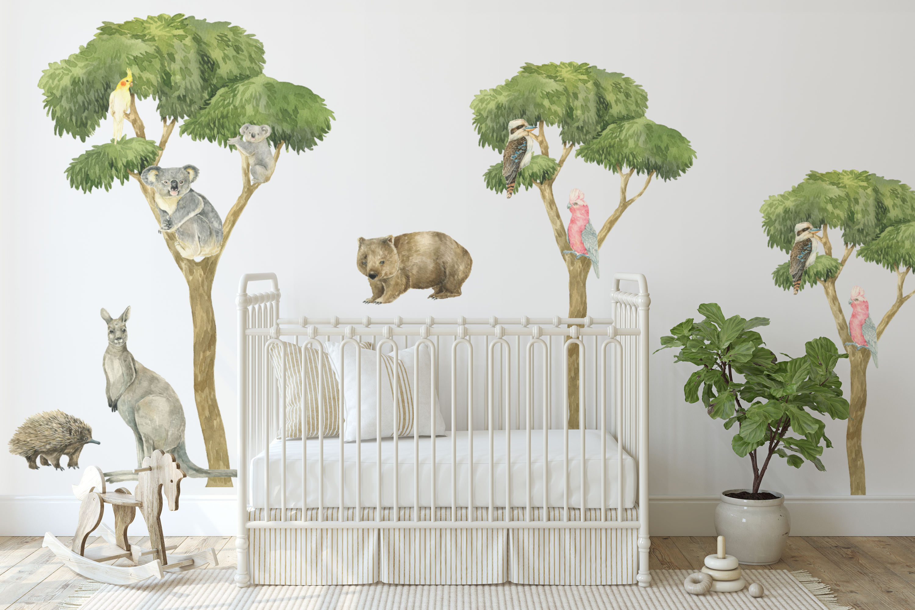 Children's room with crib, wall decals of trees, animals, and plants.
