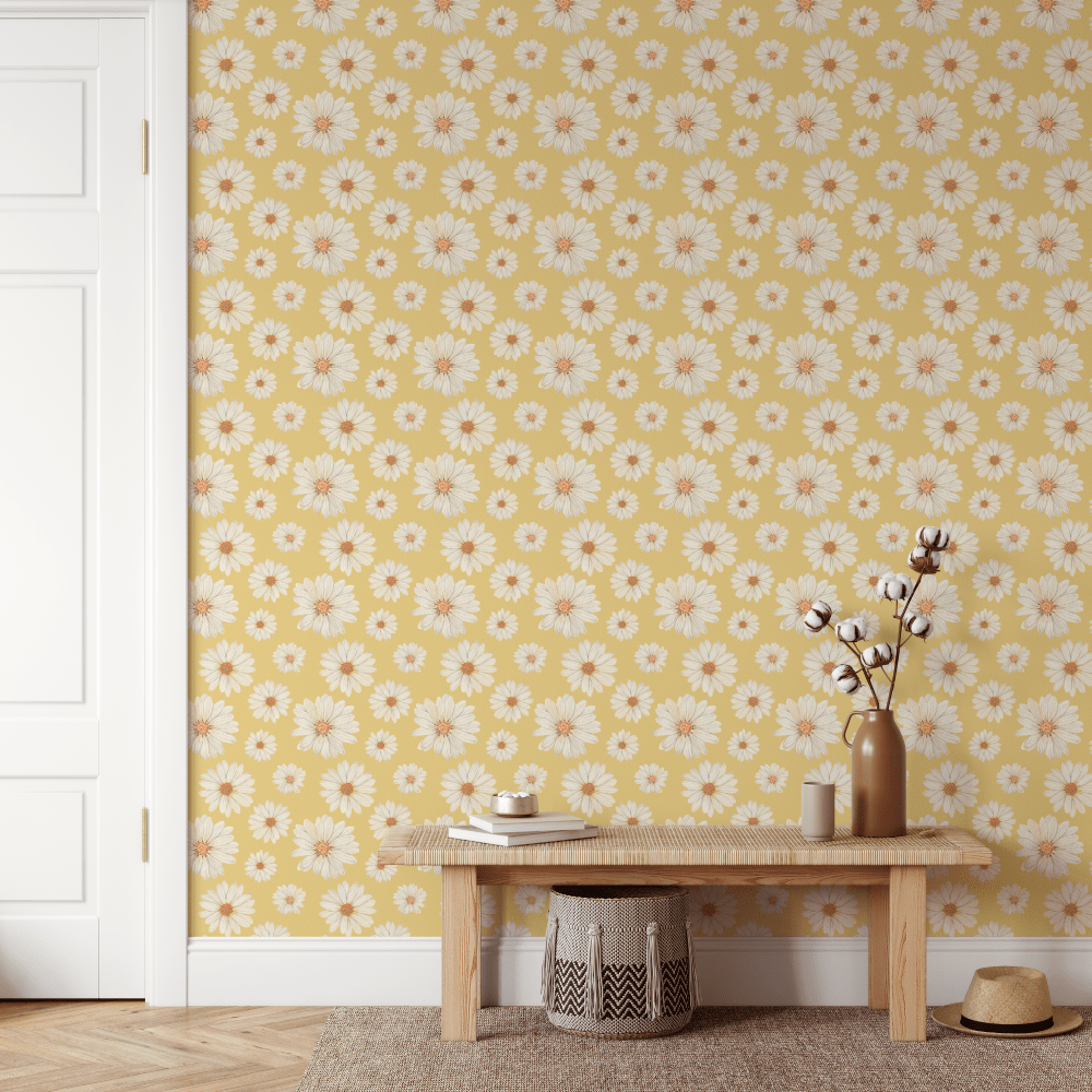 Mustard Yellow Daisy wallpaper behind a timber bench and woven baskets