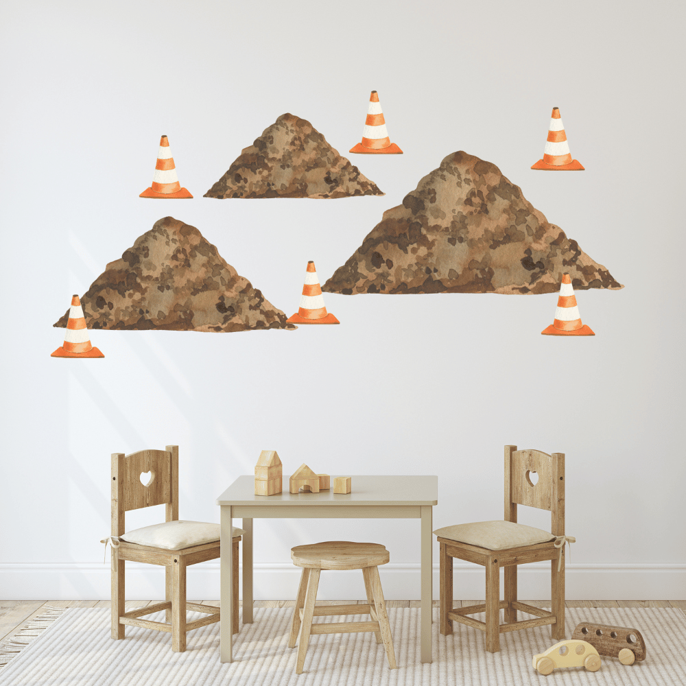 Construction dirt pile and safety cone decals above a kids table and chairs