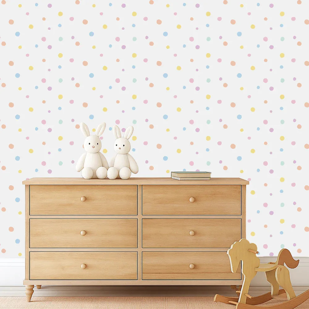 Danish Pastels spot decals scattered above a timber dresser in a nursery
