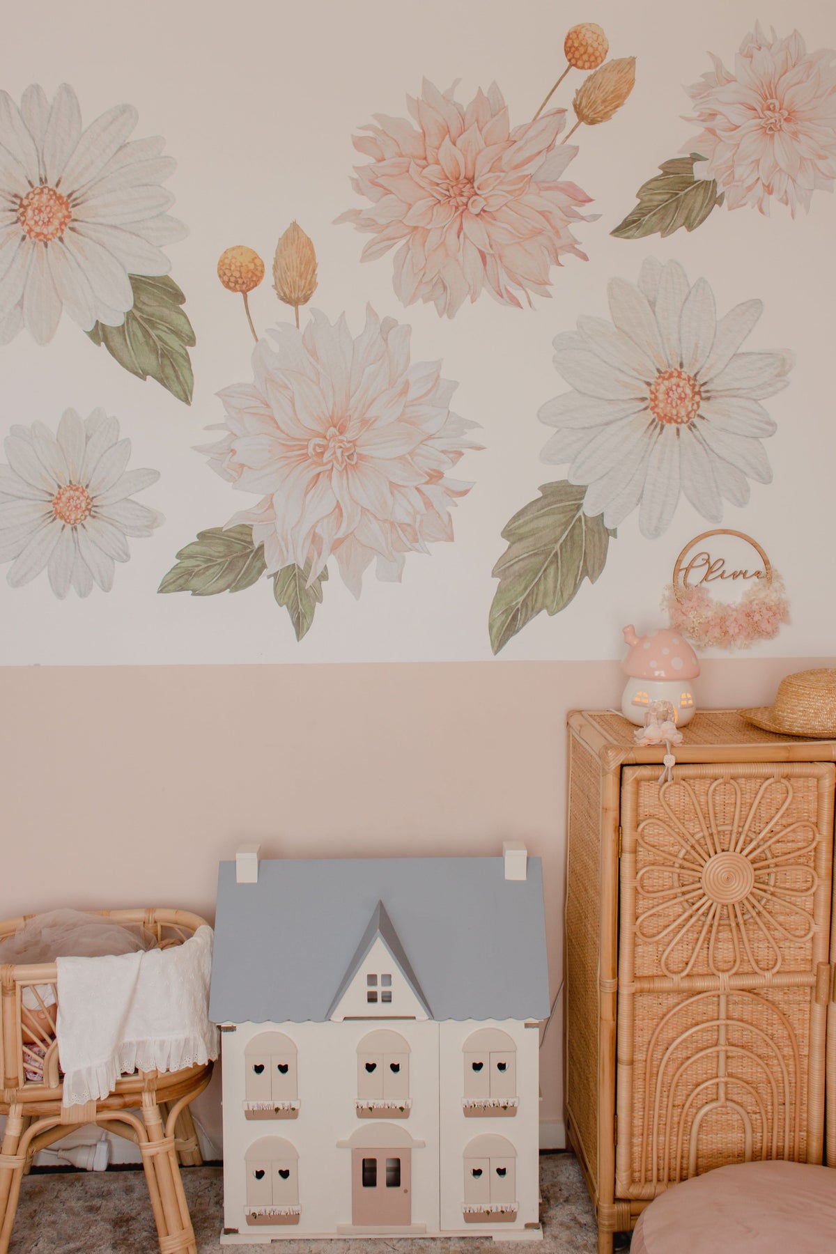 Dahlia and daisy decals above a dresser with a dollhouse and name decal