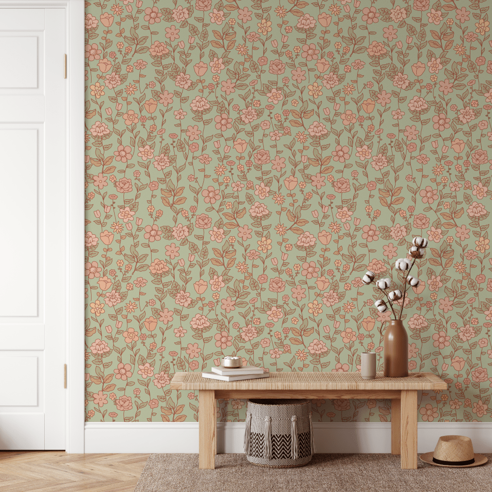 Hazel Sage Green Floral wallpaper with coral blooms above a timber bench