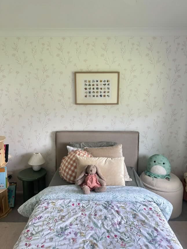 Hattie wallpaper in a child's bedroom with a bed and bookshelf