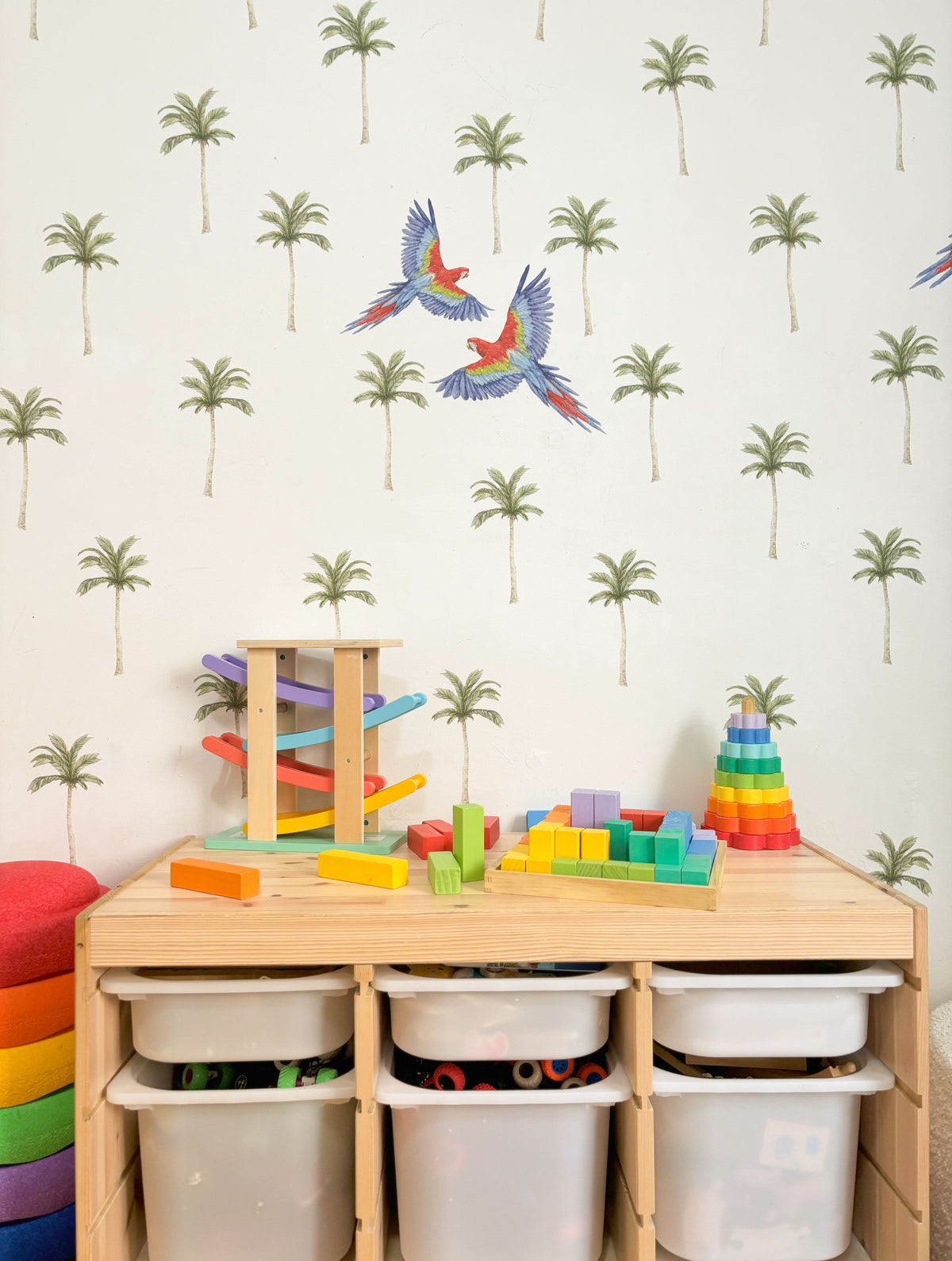 Mini palm tree decals with parrots above wooden toys