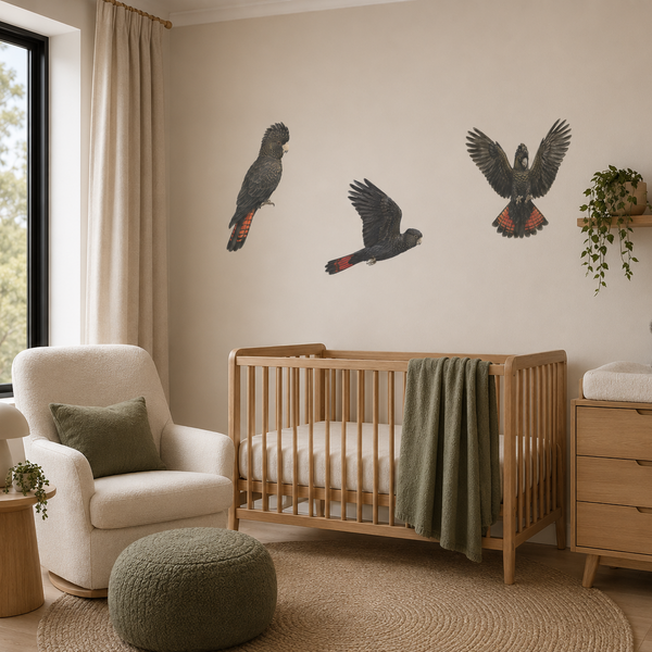 Nursery room with wooden crib, armchair, and wall art of parrots.