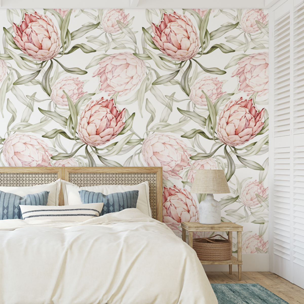 Protea wallpaper with large pink blooms behind a cane bedhead