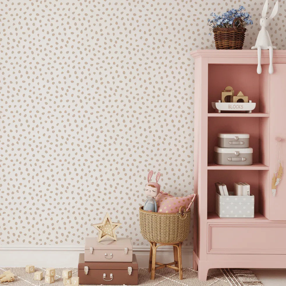 Beige Speckled Spots wallpaper in a kids room with a pink bookshelf