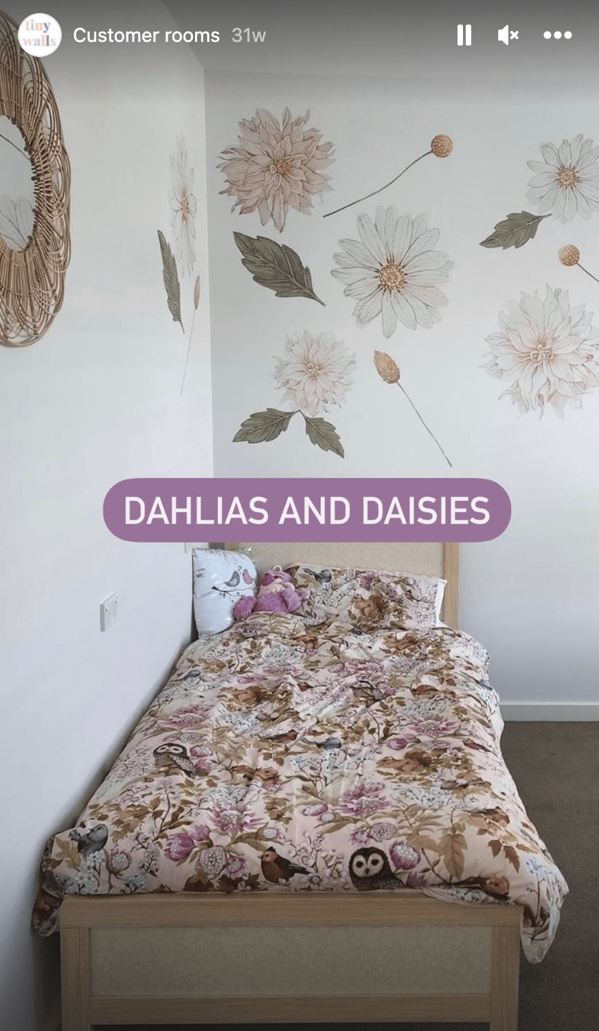 Customer photo of dahlia and daisy decals above a bed with floral bedding