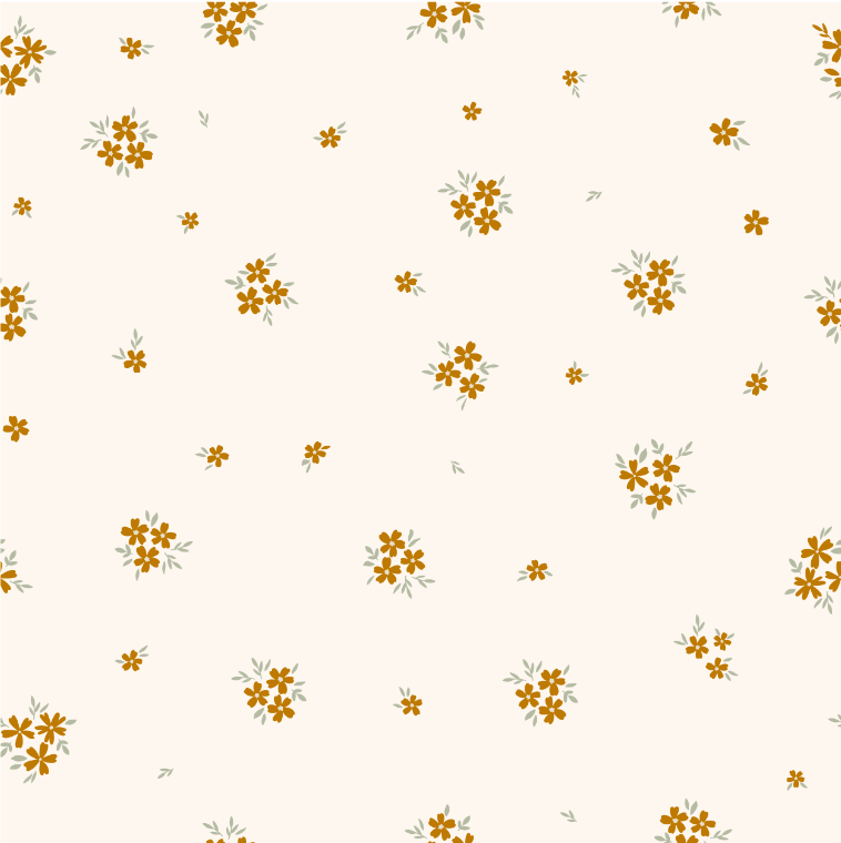 Close-up of Matilda Rust wallpaper showing tiny rust and ochre flowers on cream