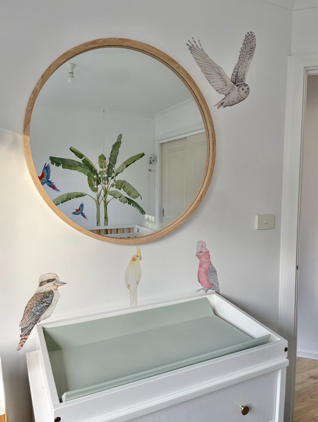 Customer photo of woodland and bird decals around a mirror in a nursery