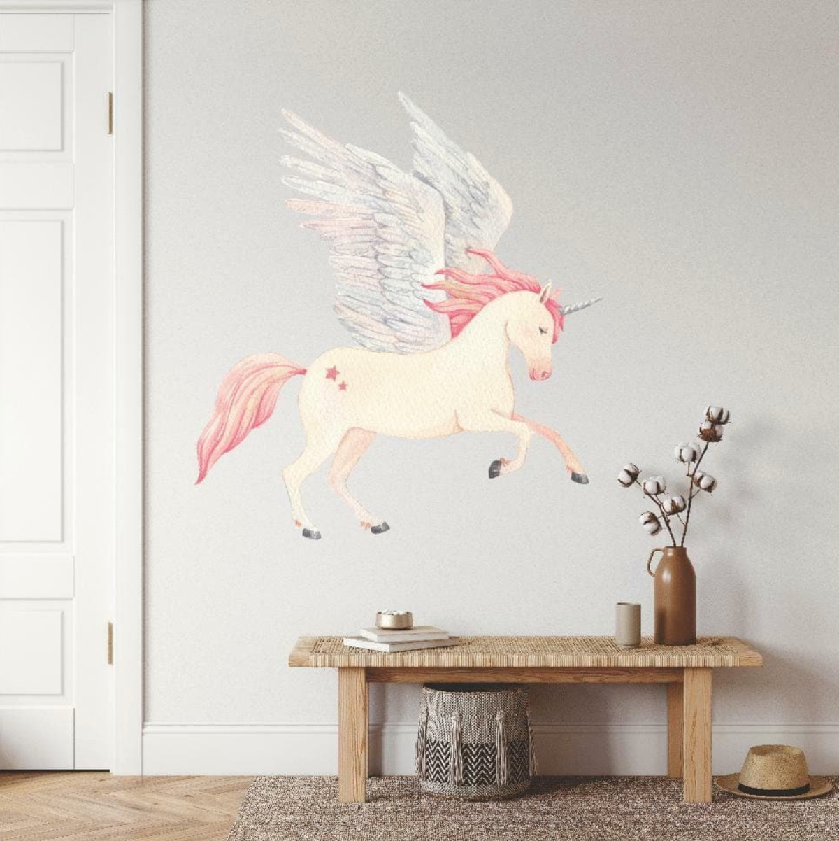 Flying unicorn wall decal above a timber bench and woven basket