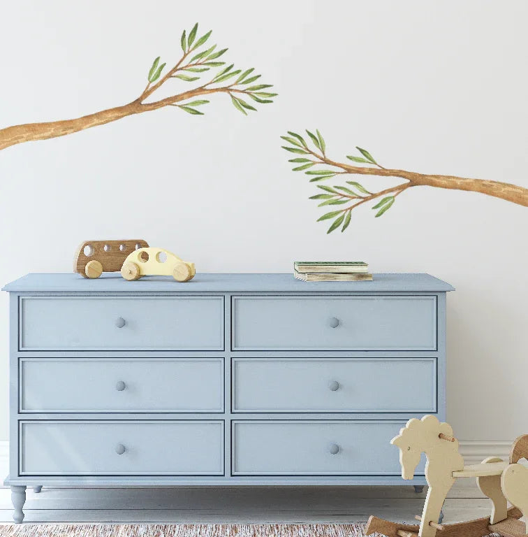 Australian gum tree branch decal above a pale blue dresser