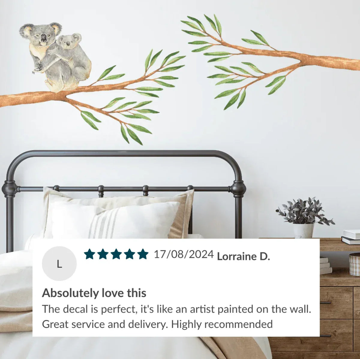 Customer photo of koala and gum branch decals above a bed