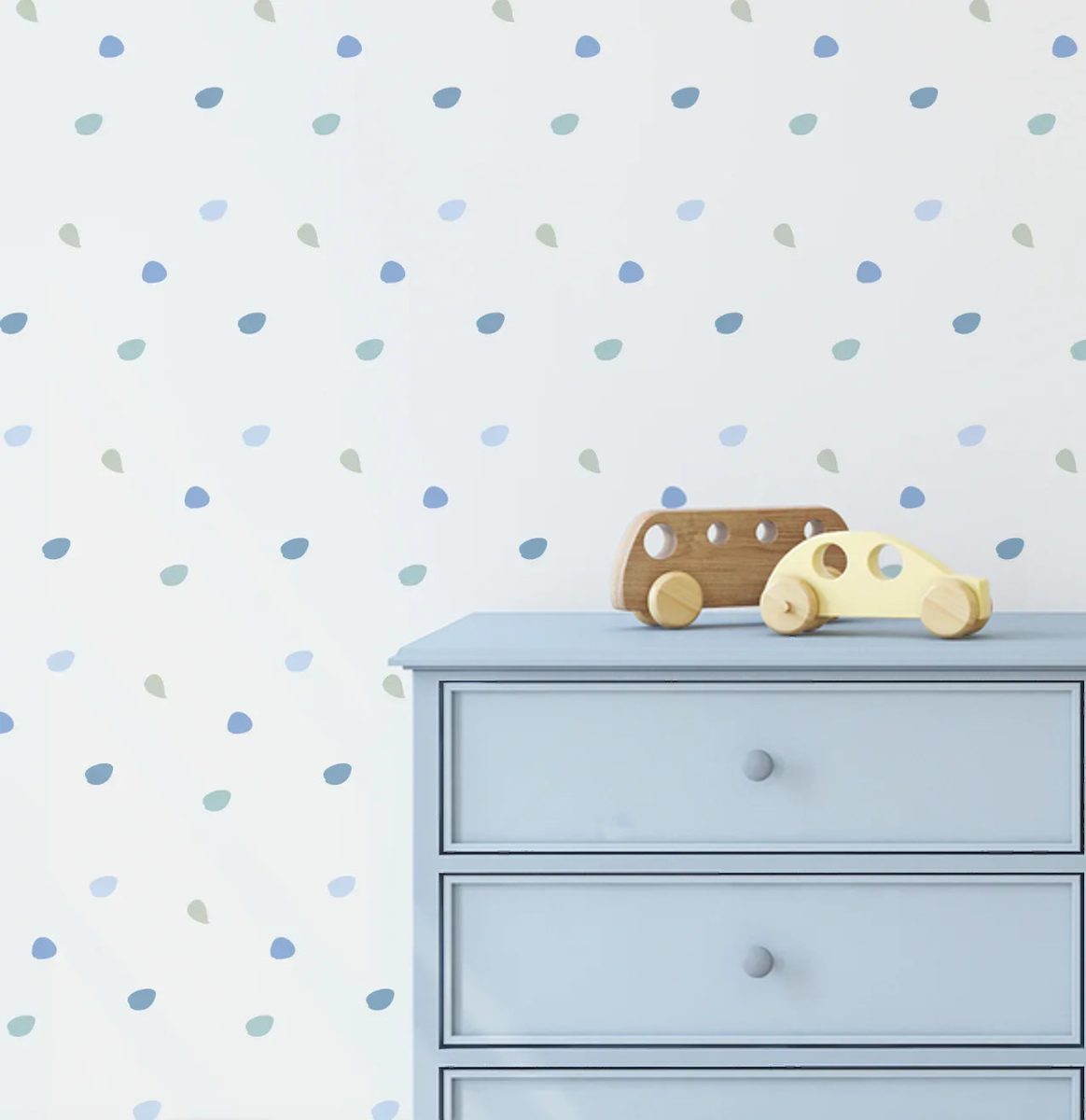 Happy Dots Cool and Calm blue decals scattered above a dresser with a toy car