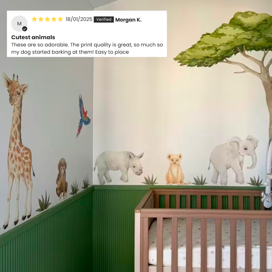Customer photo of baby safari animal decals in a nursery with green panelling