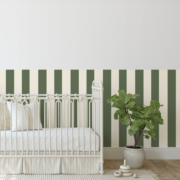 Nursery room with a white crib, rocking horse, and striped wallpaper.