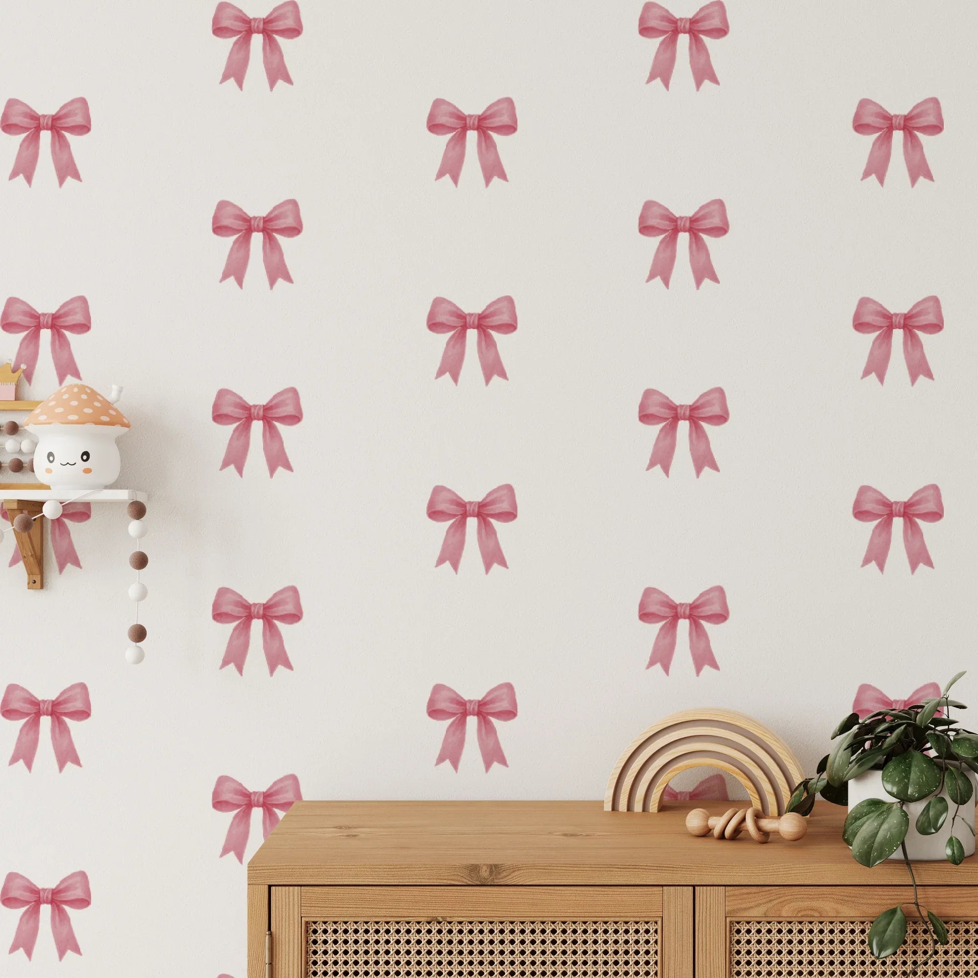 Wall with pink bow pattern and wooden shelf with decorative items