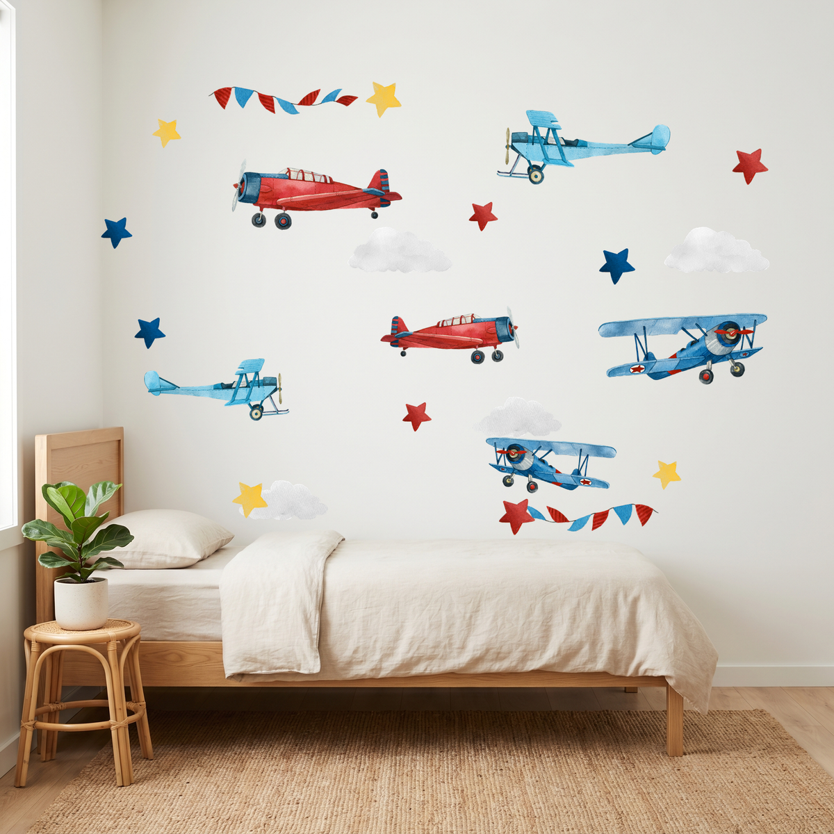 Children's bedroom with airplane wall decals on a white wall.
