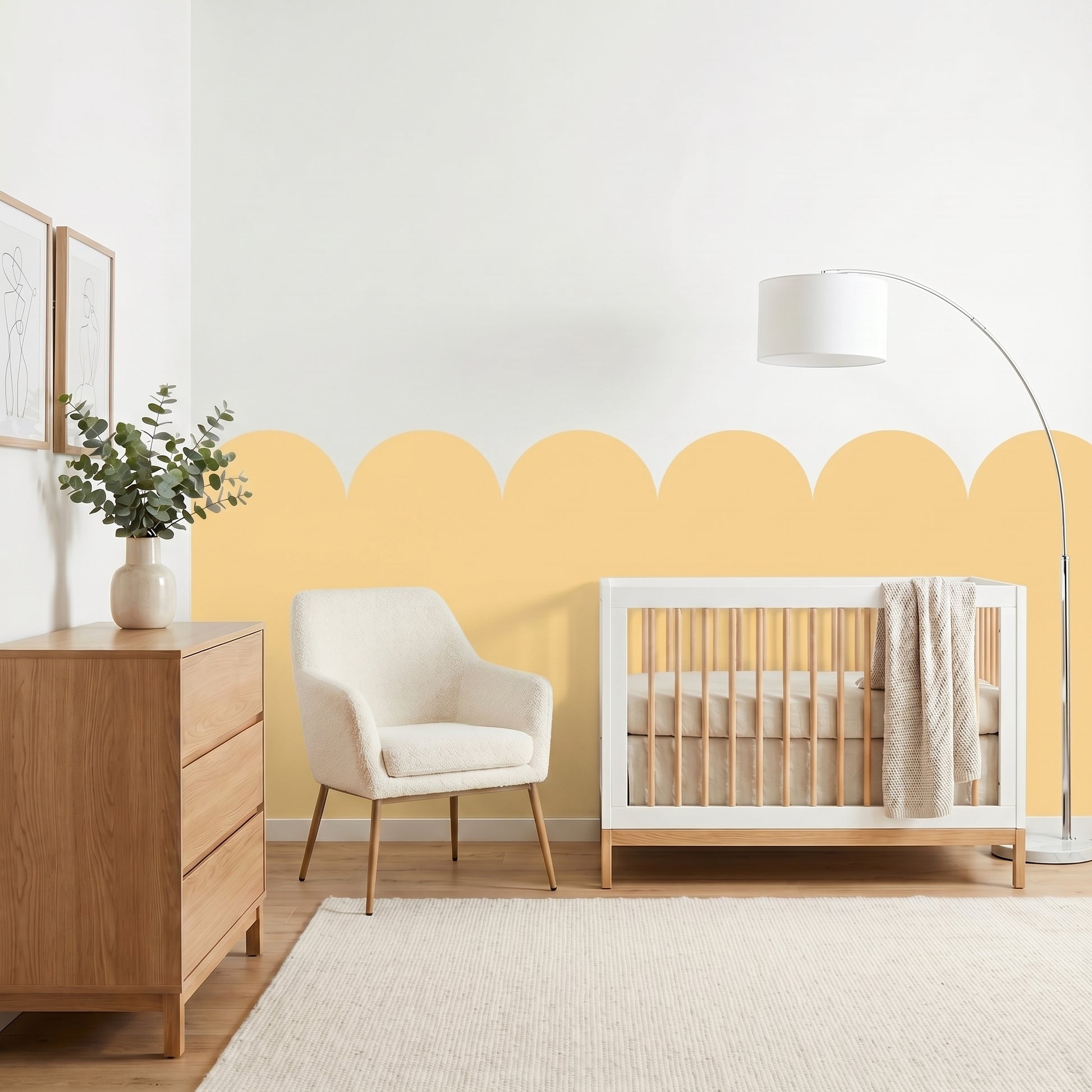 Nursery room with a crib, chair, and dresser against a yellow wall.