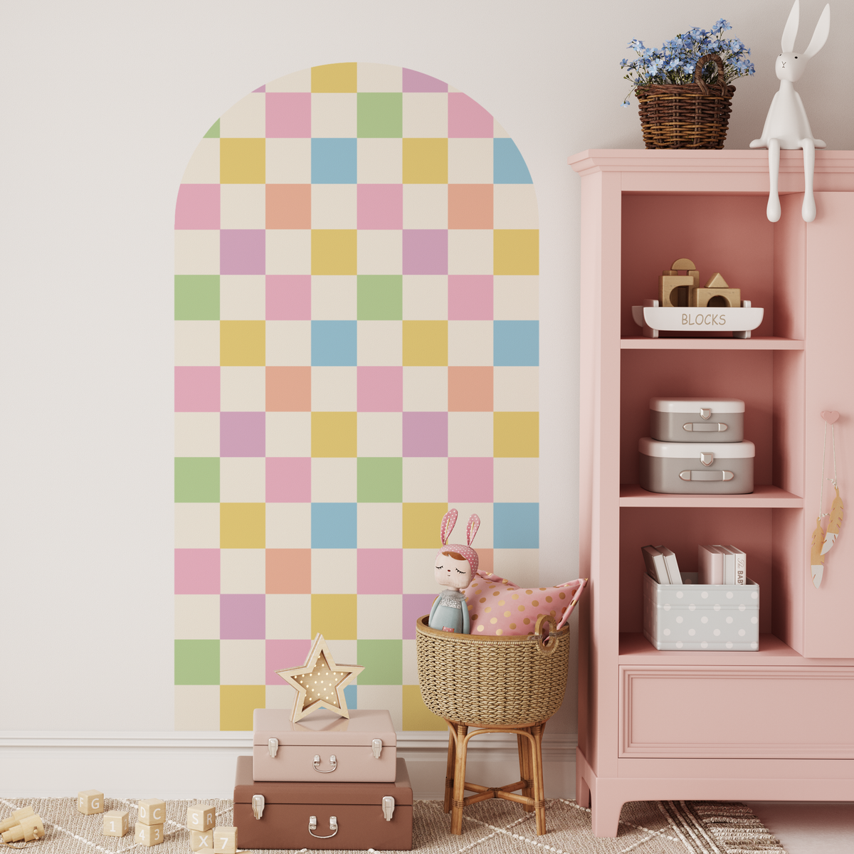 Danish Pastels checkers arch decal in pastel tones beside a pink bookshelf