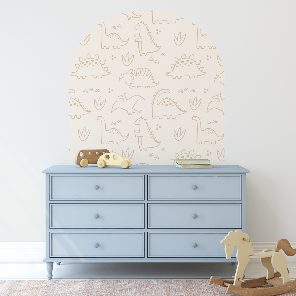 Darcy dinosaur beige arch decal above a pale blue dresser