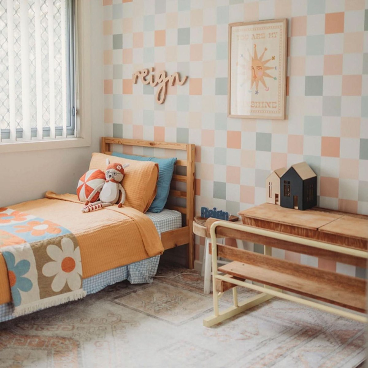 Colourful Checker wallpaper in soft pastel tones in a kids bedroom