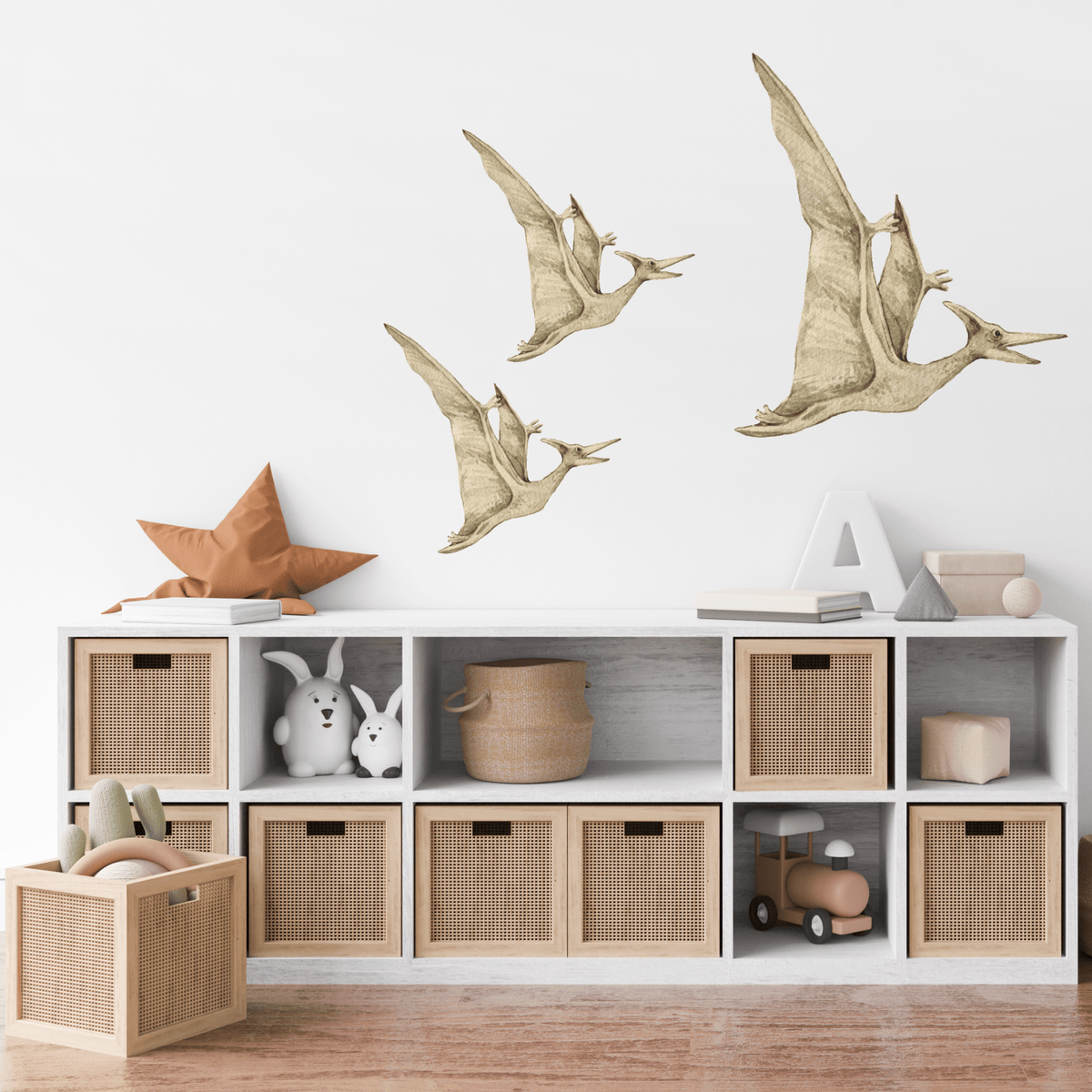 Pterodactyl dinosaur decals flying above white storage cubes
