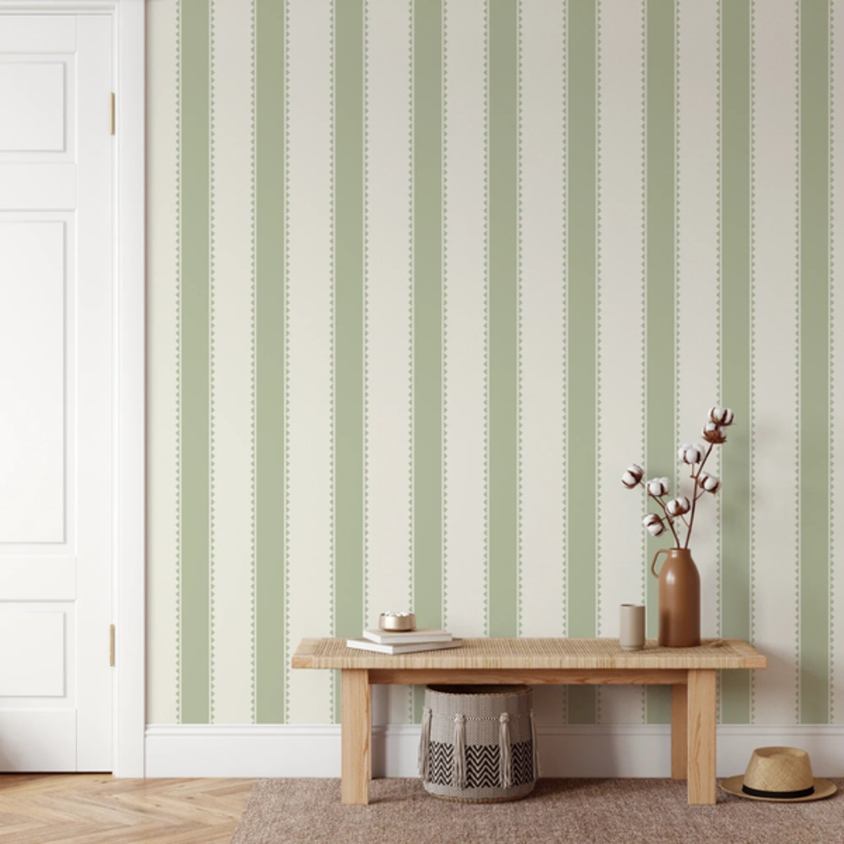 Elliot Stripes Sage Green wallpaper behind a timber bench and woven basket