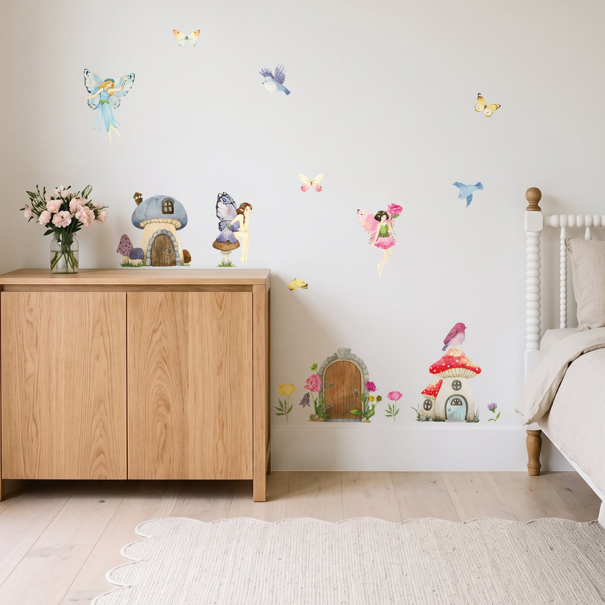 Flower fairy wall decals with a fairy village, fairies and butterflies on a girls' bedroom wall
