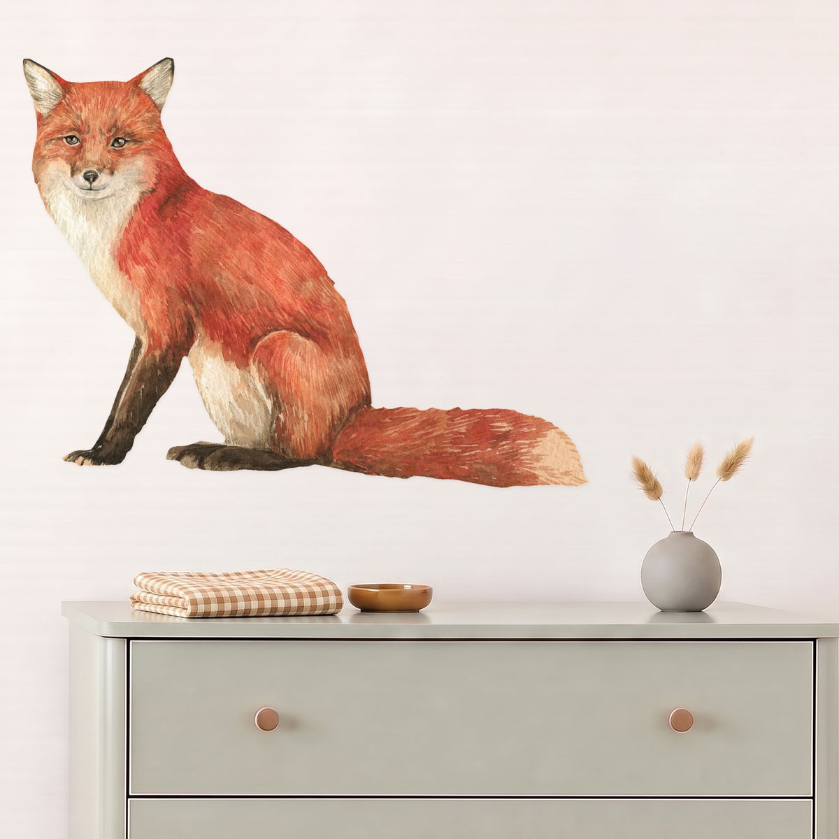 Large fox wall decal above a sage dresser in a nursery