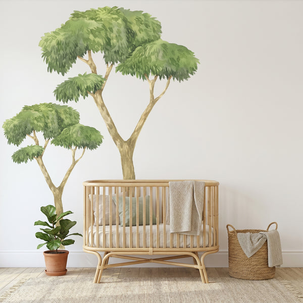 Wooden crib with a blanket in a room with plants and a basket.