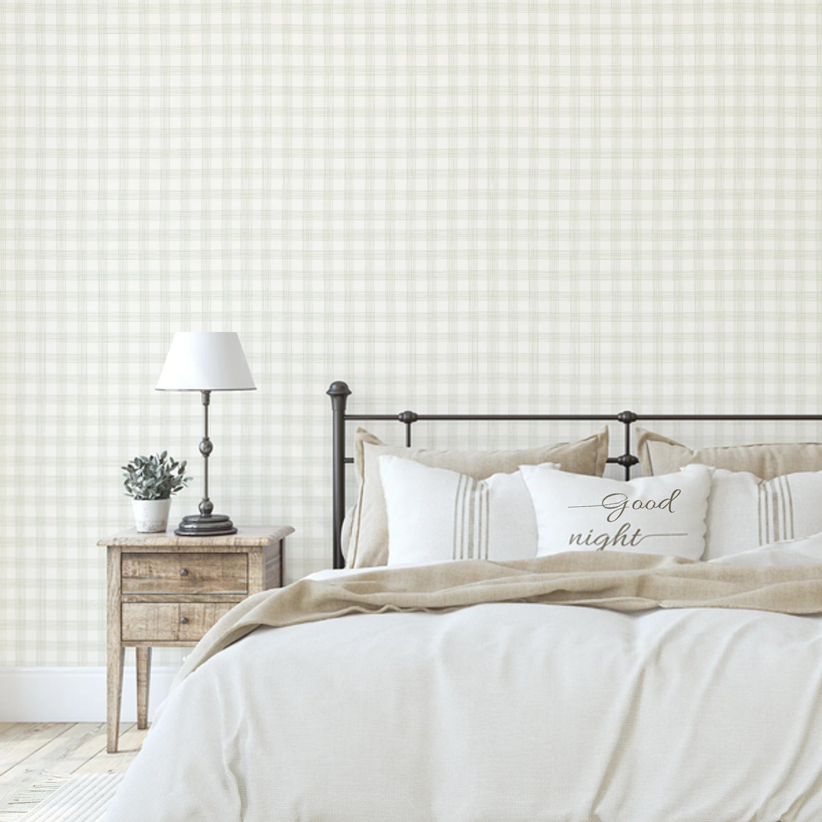 Campbell Hand Drawn Check Sage Green wallpaper in a bedroom with an iron bed