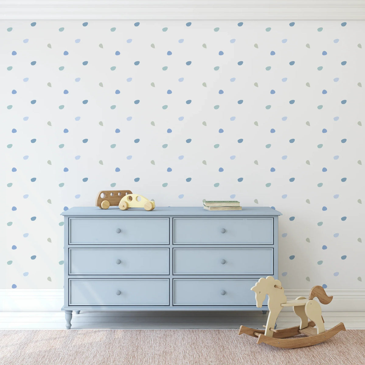 Happy Dots Cool and Calm decals in blue and green above a pale blue dresser