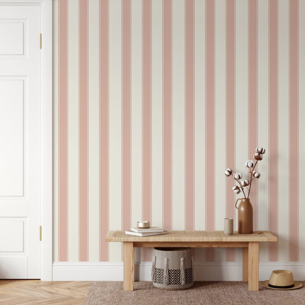 Henrietta Pink Stripes wallpaper behind a timber bench and woven basket