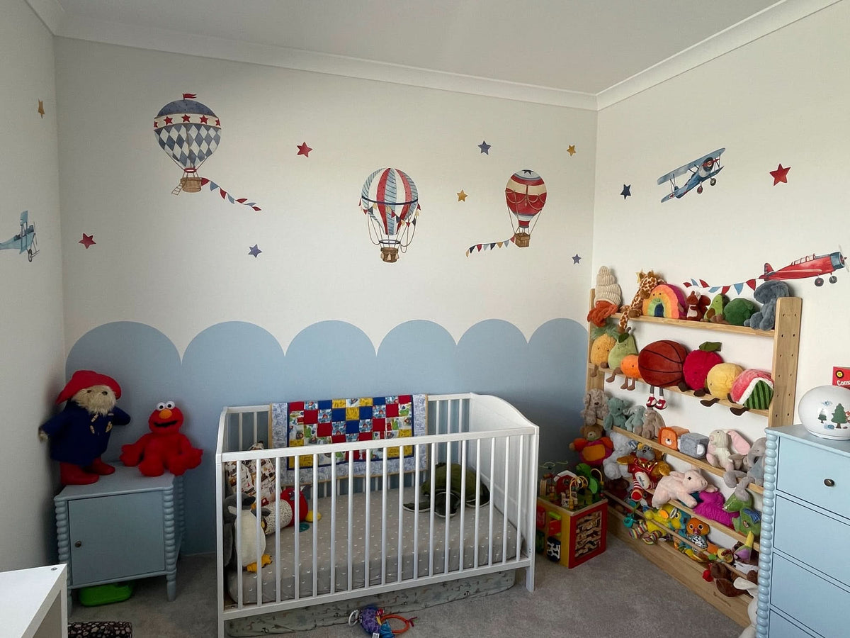 Customer photo of hot air balloon decals above a half-painted blue wall