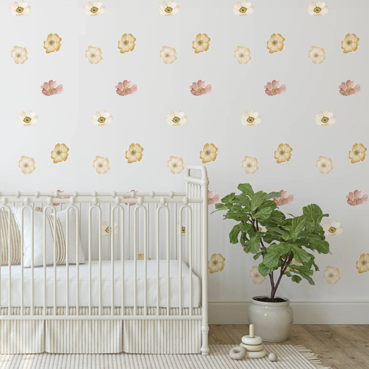 Marigold mini floral decals on a nursery wall with a potted plant