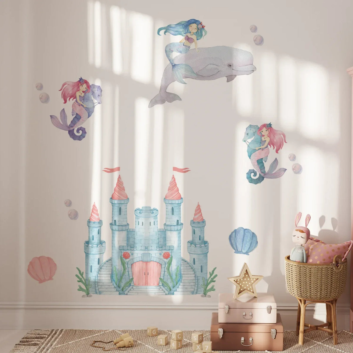 Mermaid and castle wall decals on a nursery wall with sea shells
