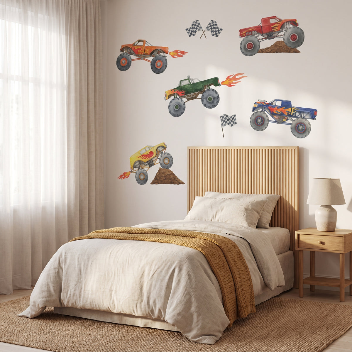 Monster Truck wall decals in a boys bedroom above a single bed