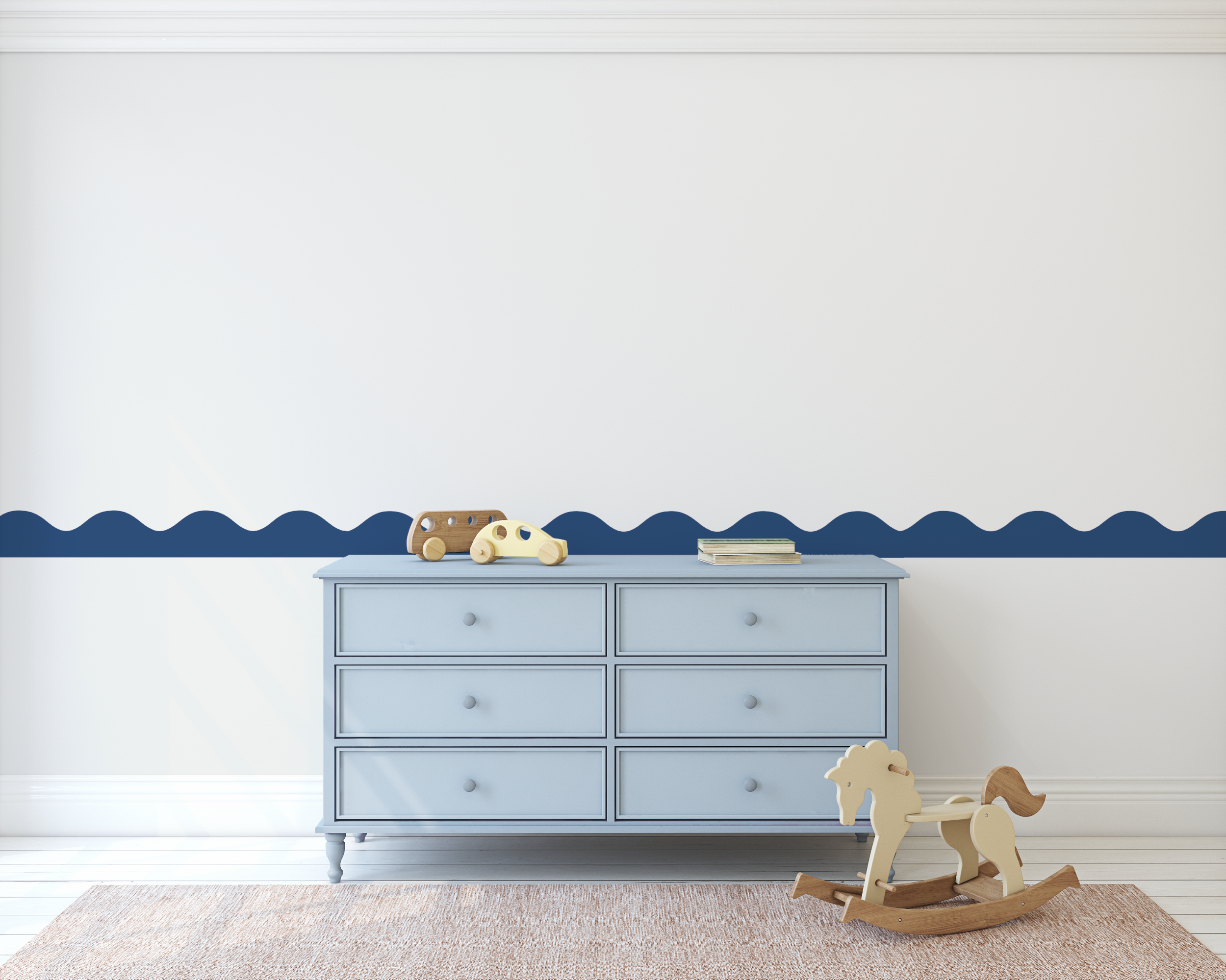 Light blue dresser with toys against a white wall with a blue decorative border
