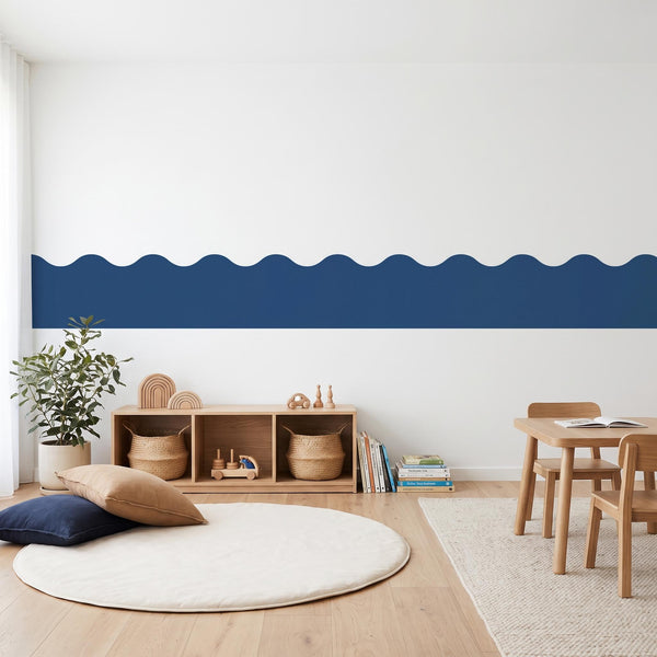 Modern room with wavy blue accent stripe on white wall, wooden furniture, and decor items.